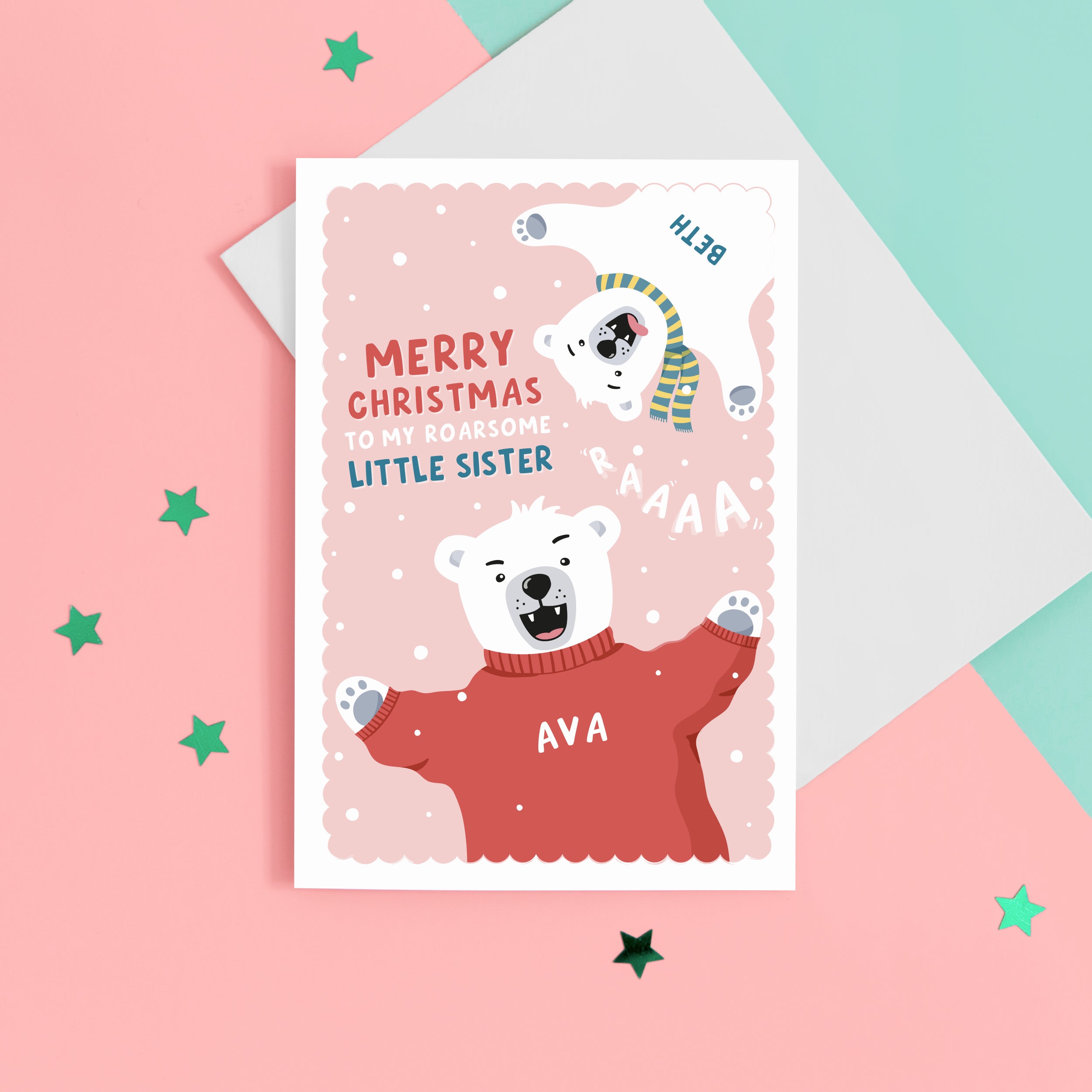 A fun Christmas card featuring two polar bears on a pink snowy background. The card reads ‘Merry Christmas to my roarsome little Sister’. The polar bears can be personalised with names to represent siblings.