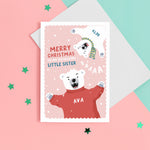 Load image into Gallery viewer, A fun Christmas card featuring two polar bears on a pink snowy background. The card reads ‘Merry Christmas to my roarsome little Sister’. The polar bears can be personalised with names to represent siblings.
