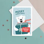 Load image into Gallery viewer, A fun Christmas card featuring a polar bear holding a big present with a tag for personalisation. T The card reads ‘Merry Christmas to a Brilliant Brother’. The card can be personalised for any recipient .
