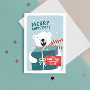 A fun Christmas card featuring a polar bear holding a big present with a tag for personalisation. T The card reads ‘Merry Christmas to a Brilliant Brother’. The card can be personalised for any recipient .