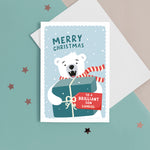 Load image into Gallery viewer, Christmas card featuring a polar bear holding a big present with a tag for personalisation. T The card reads ‘Merry Christmas to a Brilliant Son’. The card can be personalised for any recipient 
