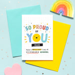 Load image into Gallery viewer, A bright and colourful secondary school card which reads, &#39;so proud of you have a brilliant time at secondary school&#39;. The card features a happy face and stars and can be personalised with a name.
