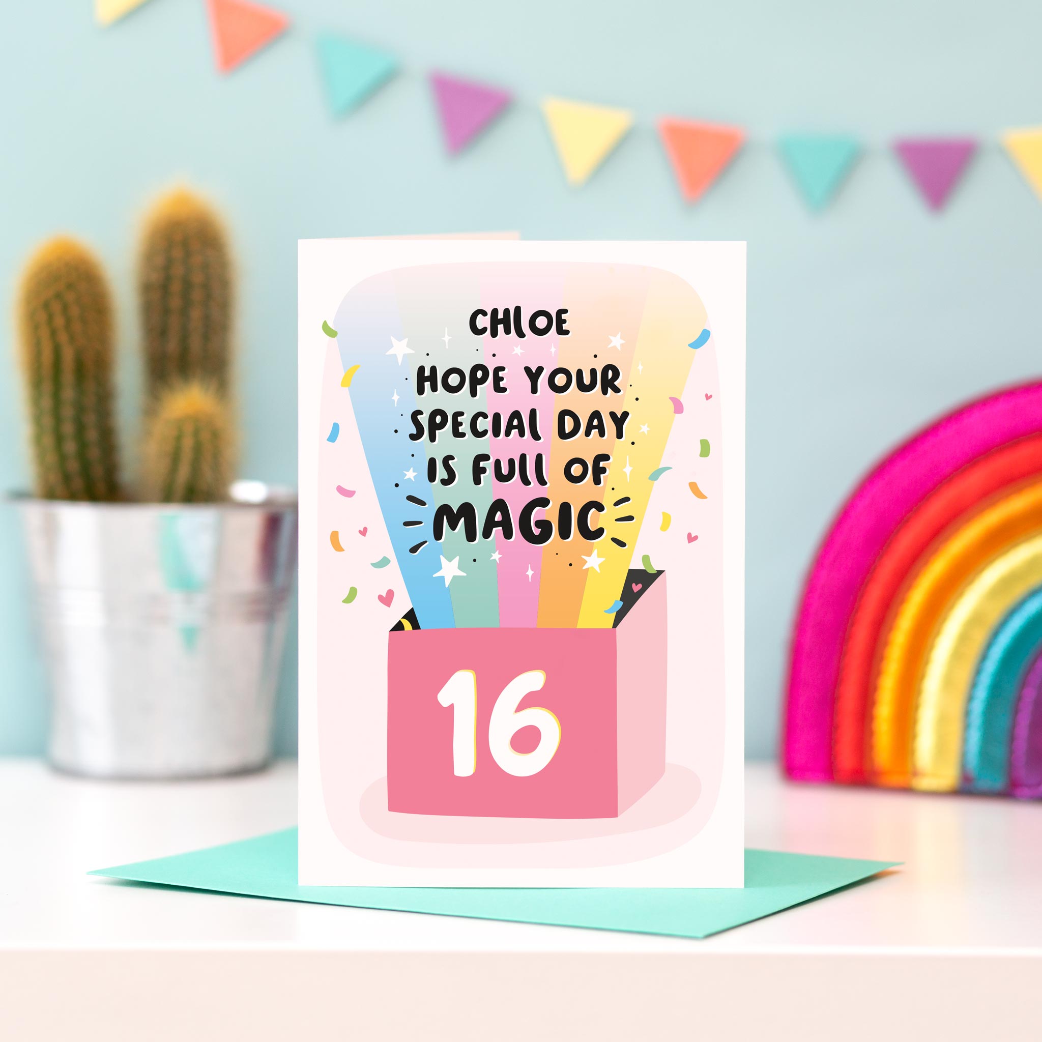 A colourful card featuring a rainbow and a pop of confetti with the words hope your special day is full of magic. This card has space to personalise with a name and any age.