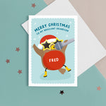 Load image into Gallery viewer, A colourful and fun card featuring a dancing and singing robin wearing a santas hat, big star glasses and wellies. The card reads ‘Merry Christmas to my brilliant Grandson&#39; with space to personalise with your Grandson’s name.
