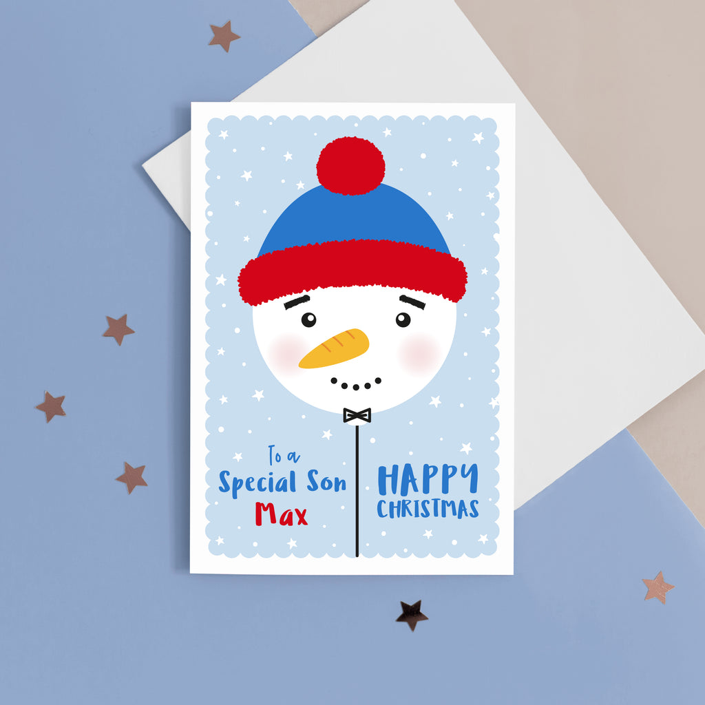 To a special Son, Happy Christmas. A cute personalised christmas card featuring a cute snowman balloon on blue background with snow and stars. Add any name and personal greeting to this card.