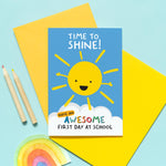 Load image into Gallery viewer, bright and happy good luck on your first day at school card. Features a smiley sunshine and colourful text. The wording reads, time to shine, have an awesome first day at school. Personalised with any child&#39;s name
