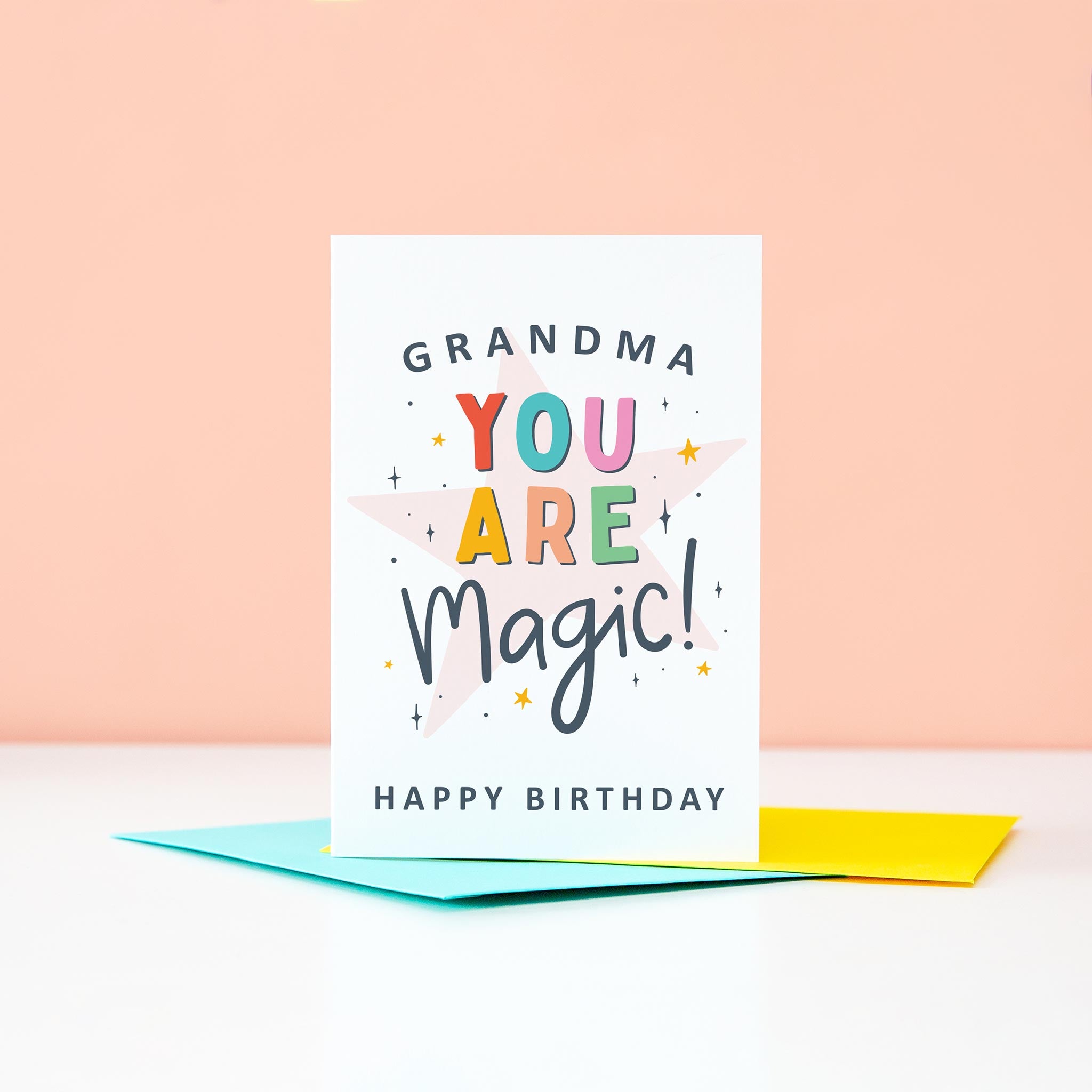 Grandma you are magic Happy Birthday. This bright and colourful typographic card features stars and bold text.