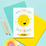 Load image into Gallery viewer, You are my sunshine card with personalised name. This cute and colourful card features a smiling happy sun and the popular quote.
