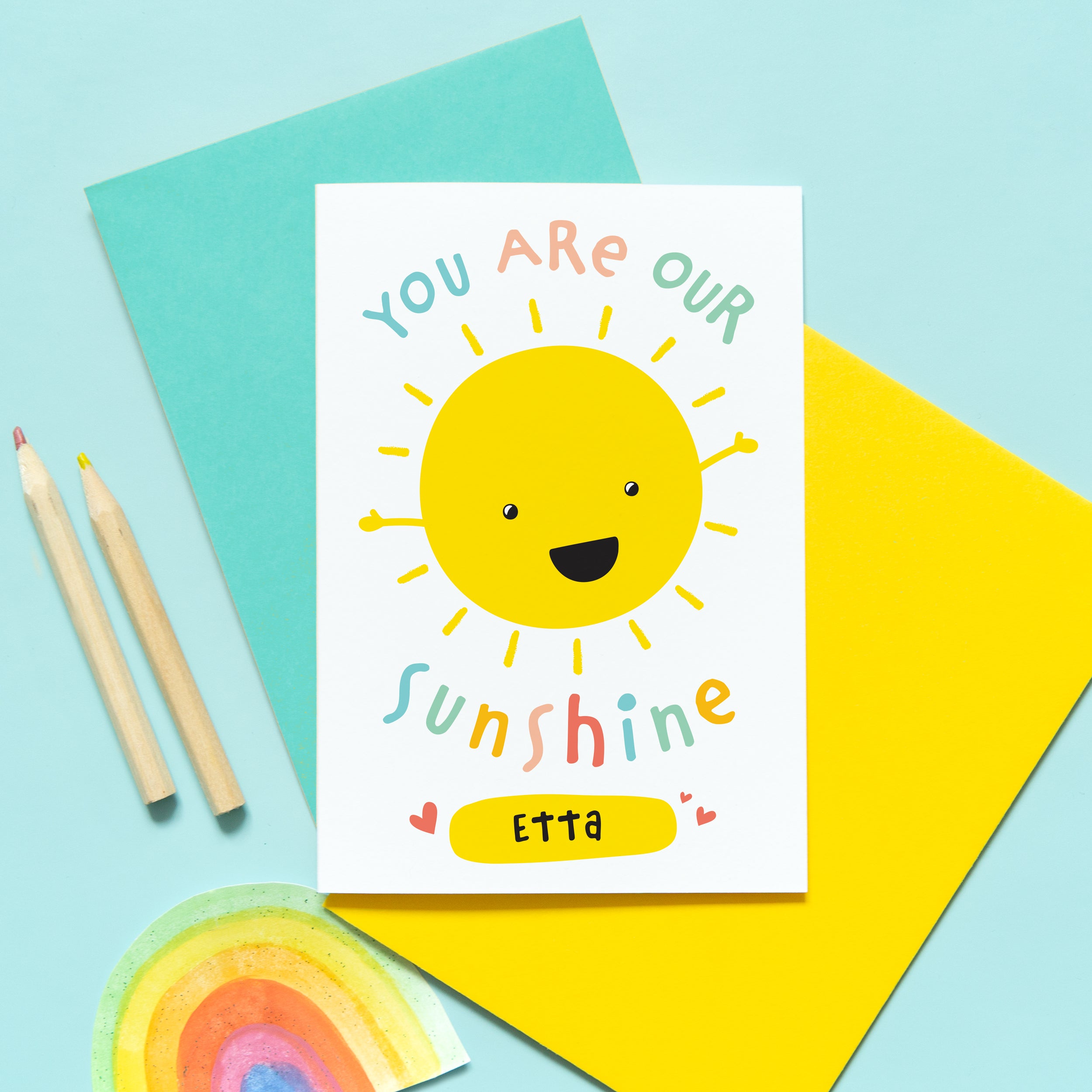 You are our sunshine card with personalised name. This cute and colourful card features a smiling happy sun and any personalised name.